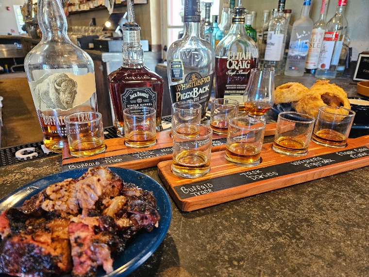 4 bourbons in a glass with spareribs as part of the bourbon tasting